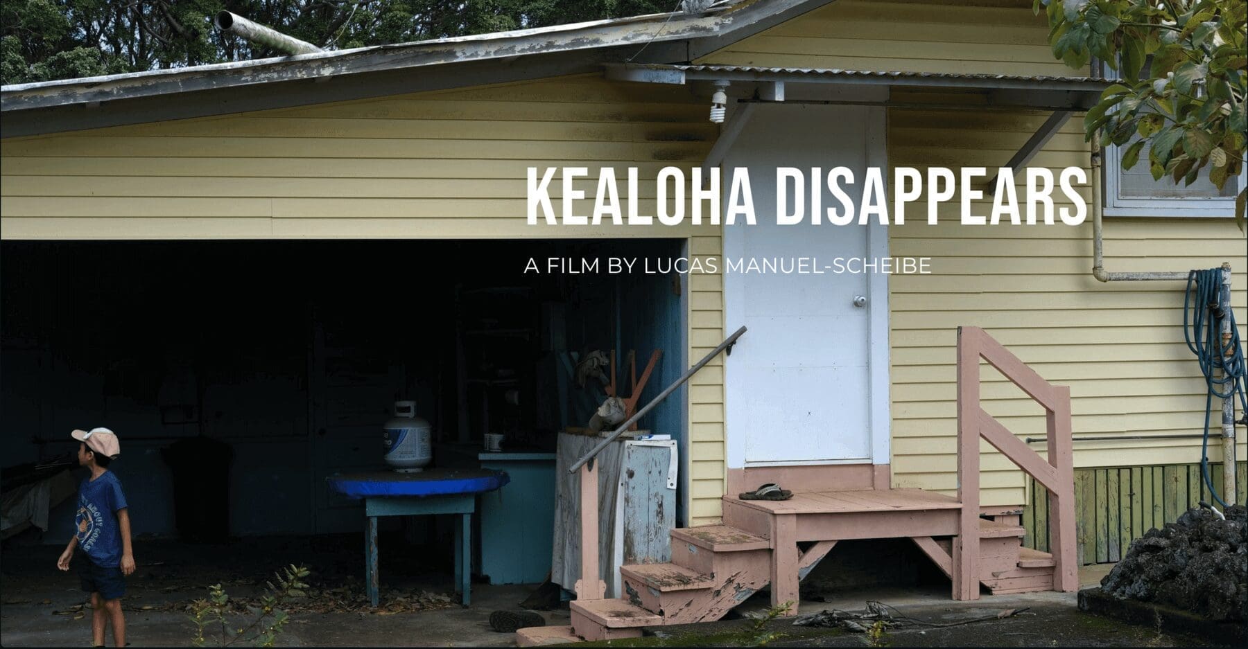 A yellow house with a door open and the words kealoha disappeard